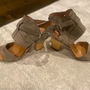Tan/taupe suede sandal with buckle ankle and light wear. Size 8.